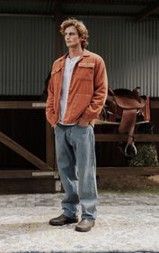 Jack Sacks full length orange jacket look